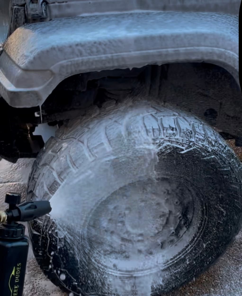 Sleek Dudes Wheel and Tire Car Care collection featuring a Jeep Wheel with soap foam on it