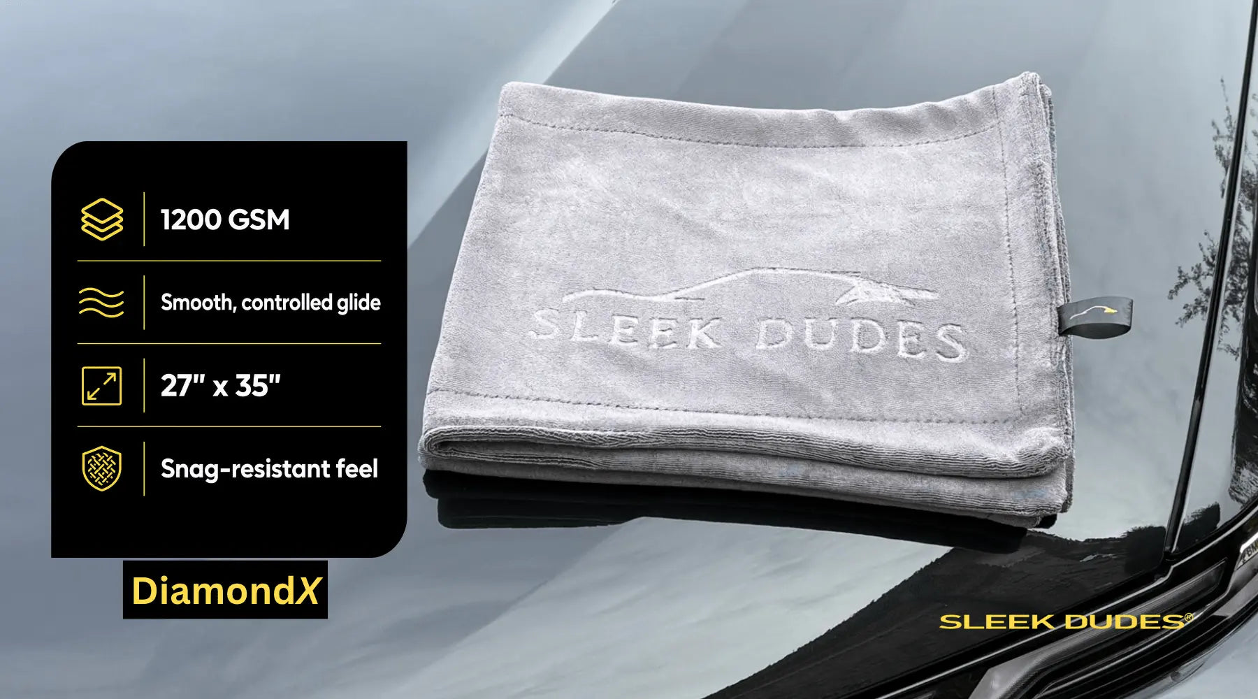 Gray towel with 'Sleek Dudes' branding on a car window, featuring product details.