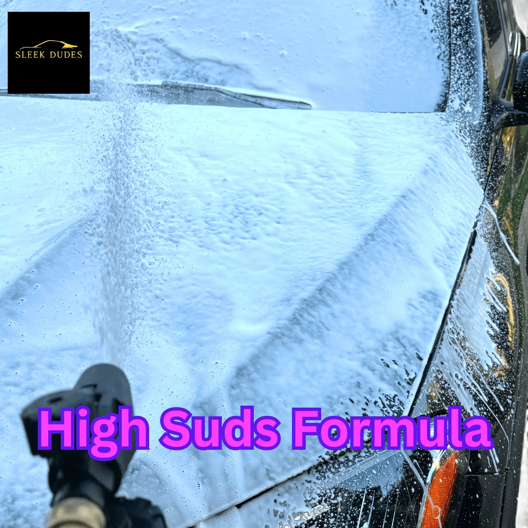 Car being washed with a high suds formula, featuring the Sleek Dudes logo.