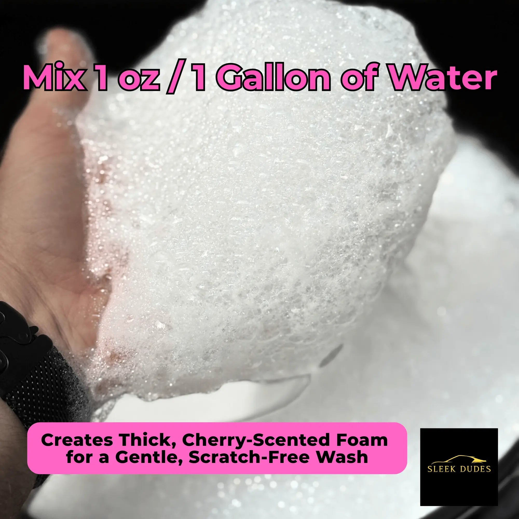 Hand holding thick foam showing Sleek Dudes Sleek Pink Soap dilution ratio 1 oz per gallon – creates cherry-scented, scratch-free wash.