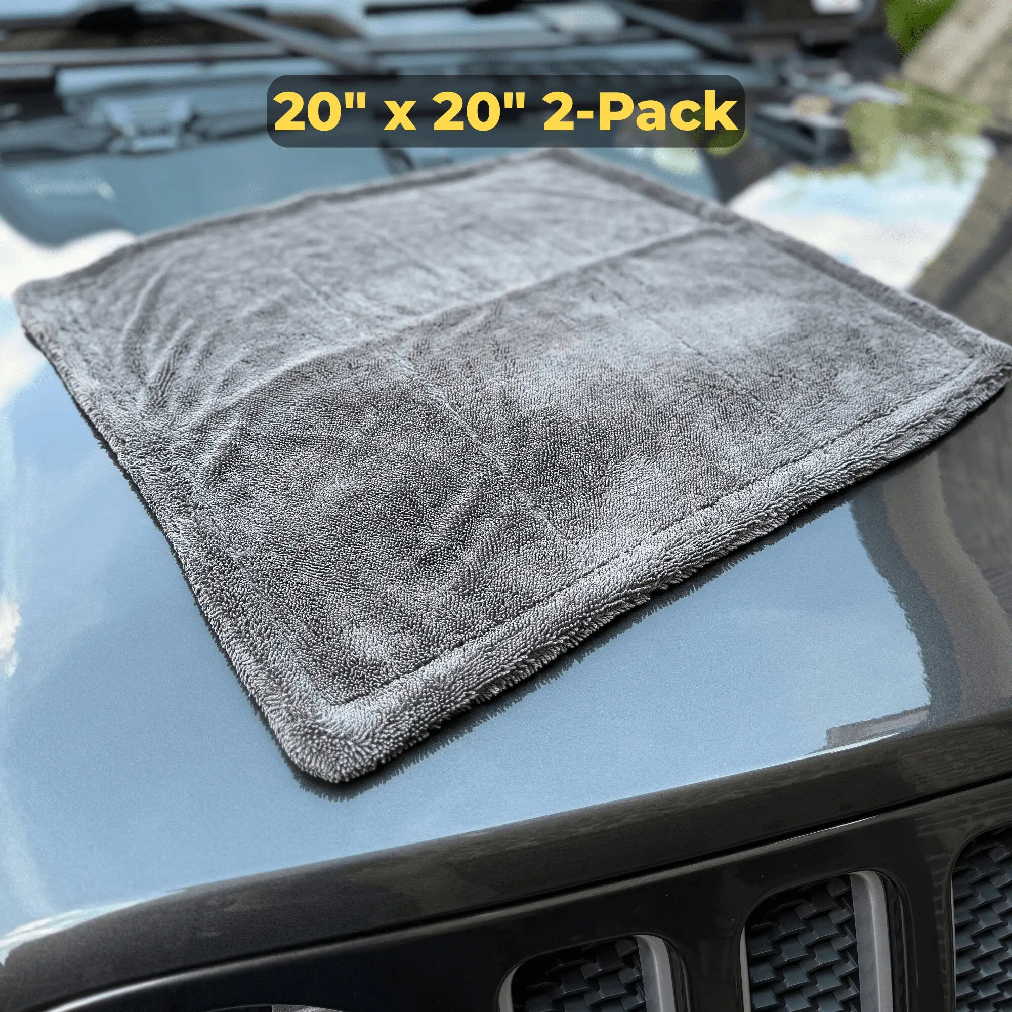 Gray microfiber towel on a car hood with '20" x 20" 2-Pack' text.