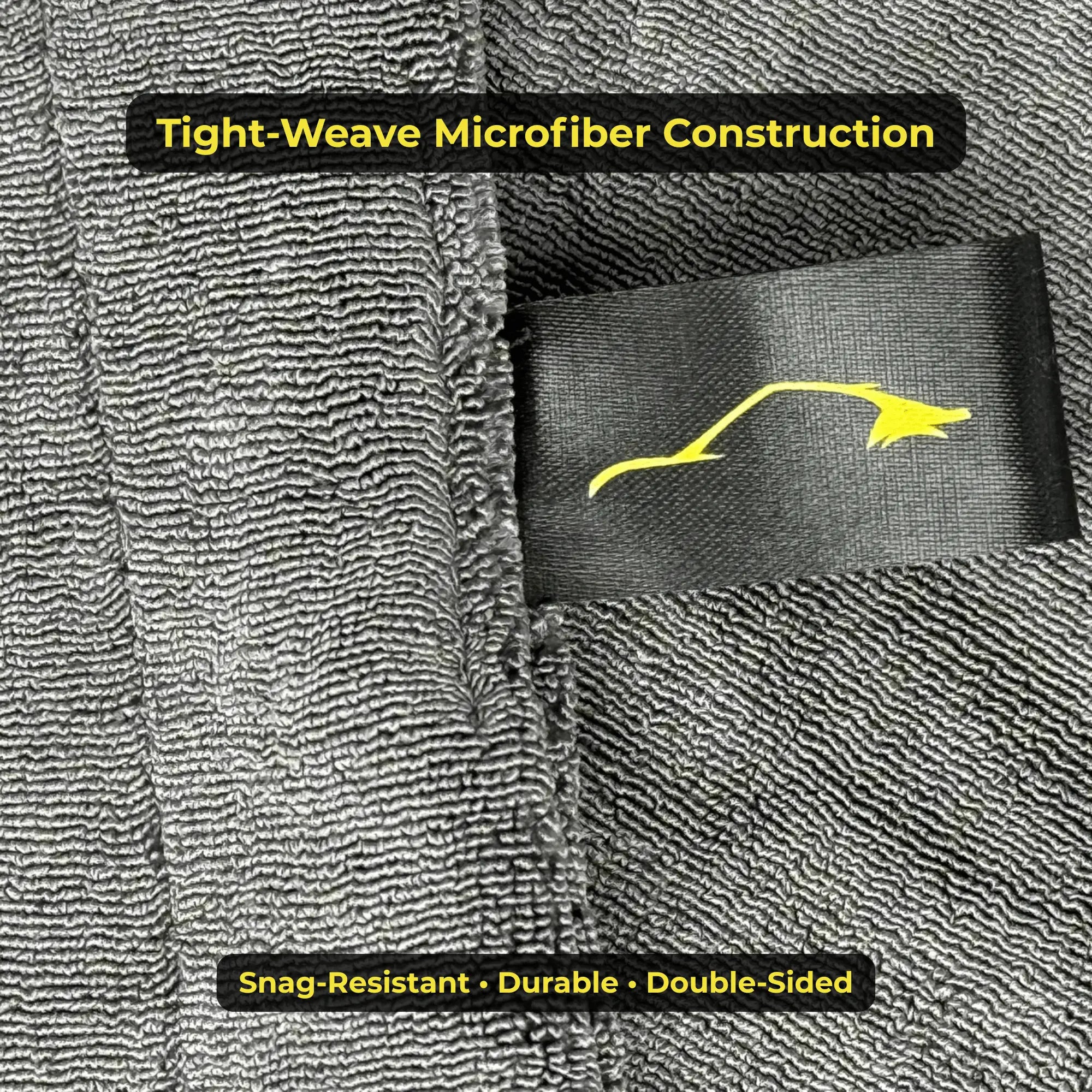 Close-up of a gray microfiber towel with a brand logo and text highlighting construction and features.
