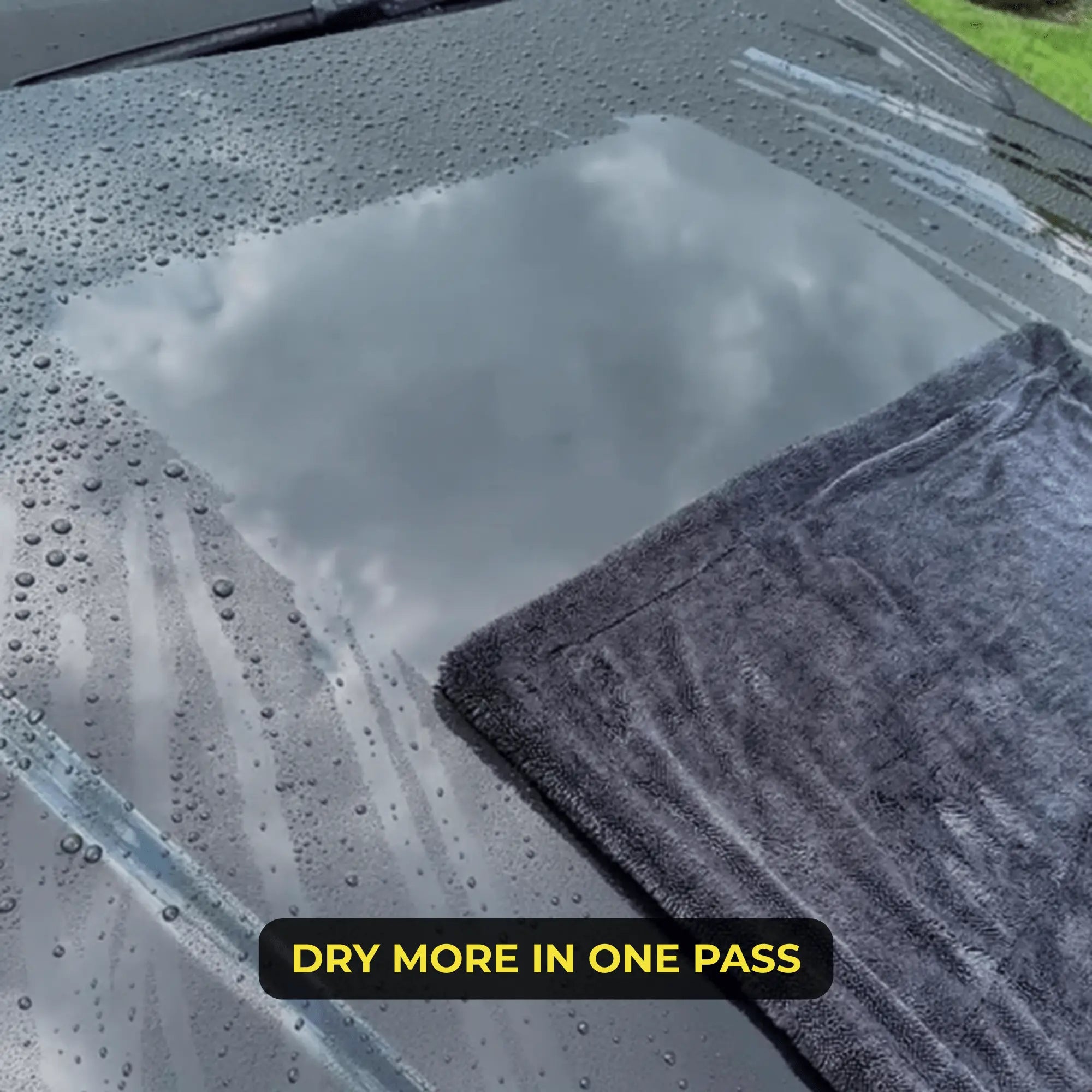 Sleek Max Dry 2K towel absorbing water on car hood.