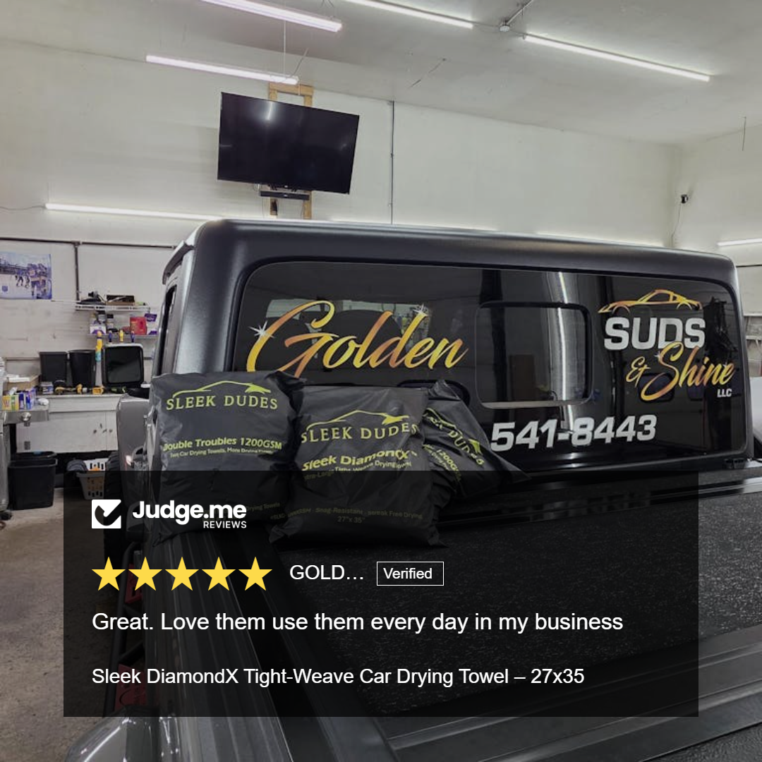 Truck with 'Golden Suds & Shine' branding in a garage setting, featuring Judge.me review.