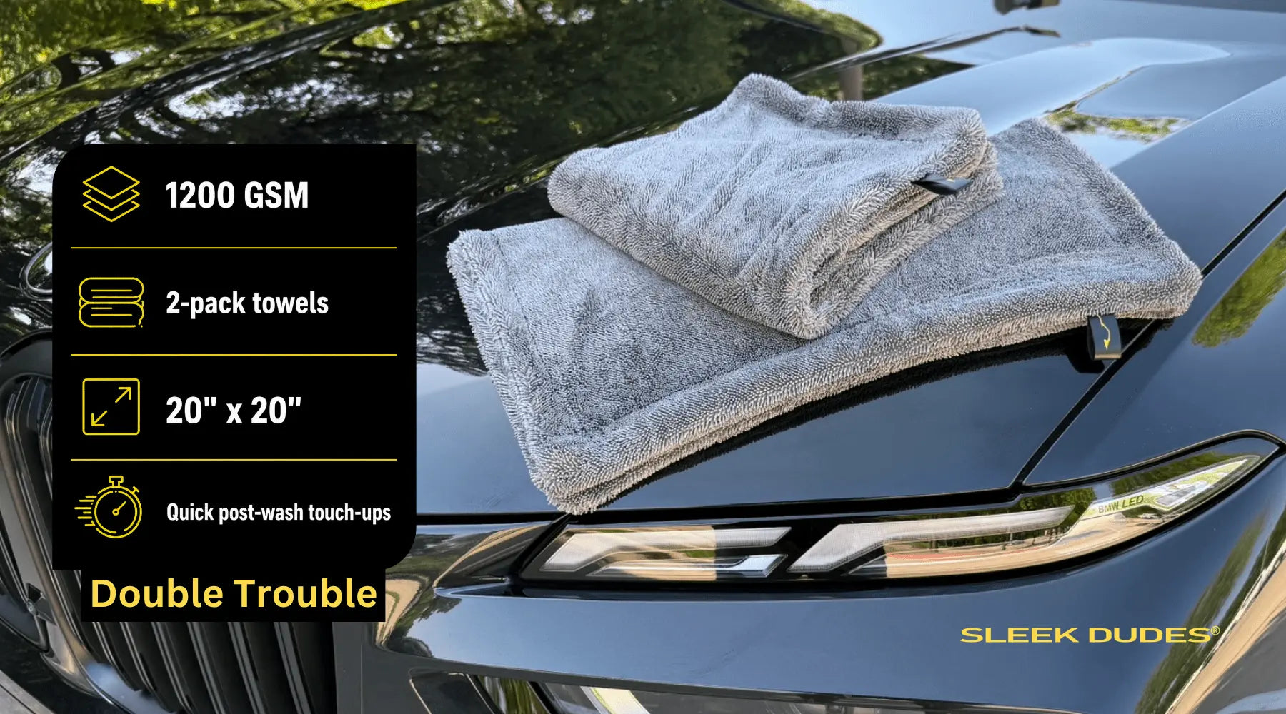 Two gray towels on a car hood with product details and 'Sleek Dudes' branding.