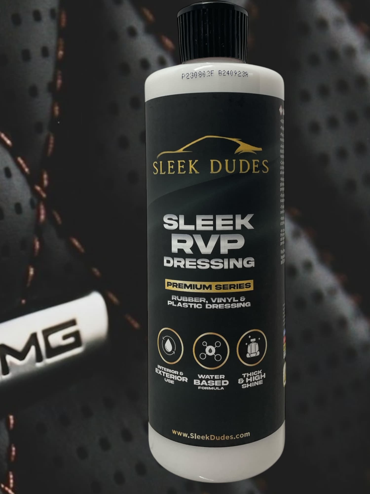Sleek Dudes RVP Dressing bottle placed in front of a premium leather car seat, highlighting its use for restoring and protecting rubber, vinyl, and plastic surfaces