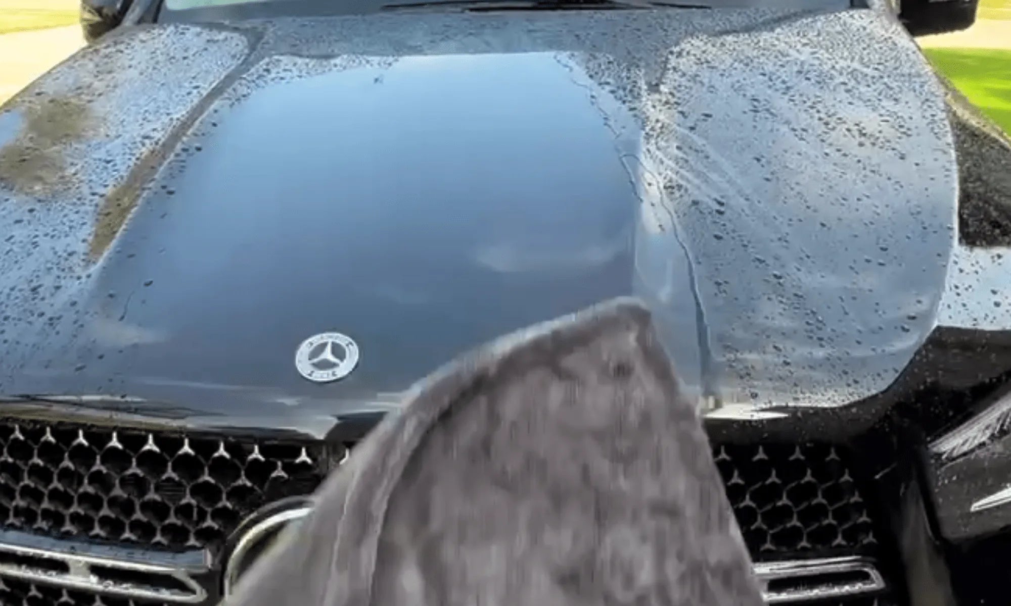 Mercedes-Benz car with a cloth on the hood