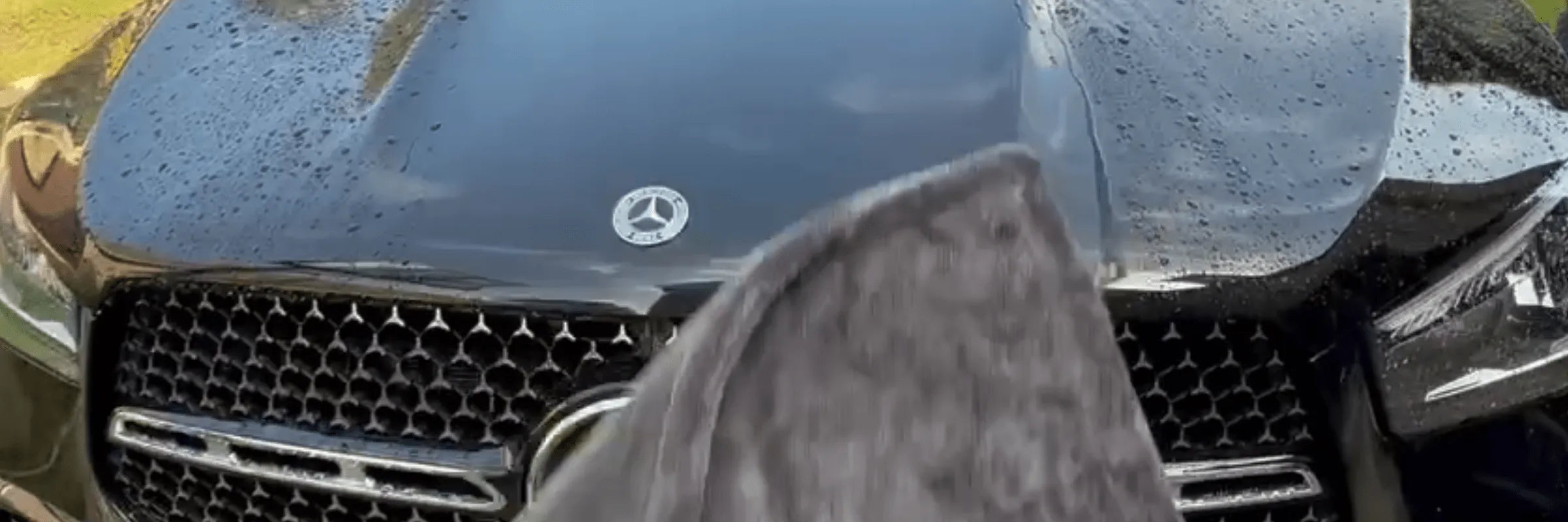 2000GSM Car Drying Towel wiping down a black car hood