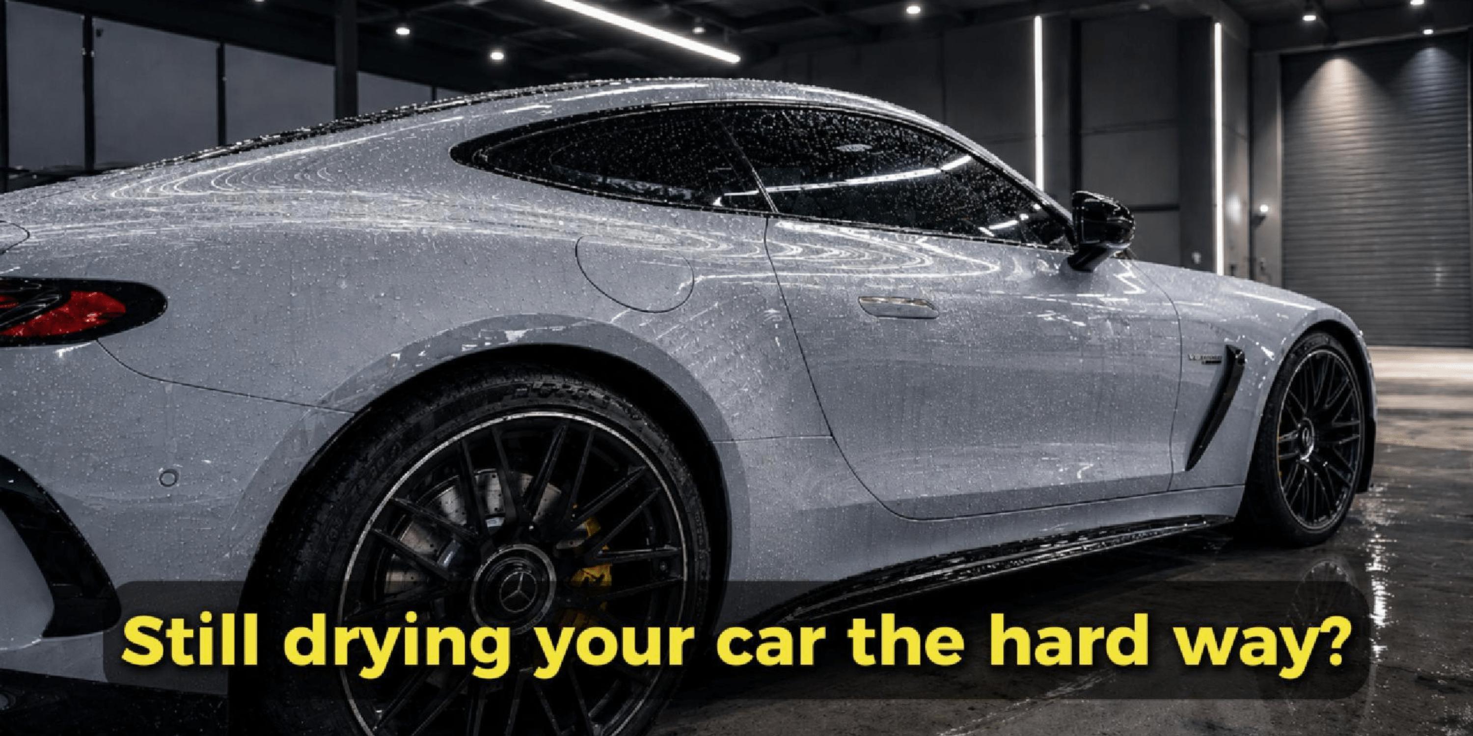 Wet Car parked in a garage with a text" Still drying your car the hard way?"