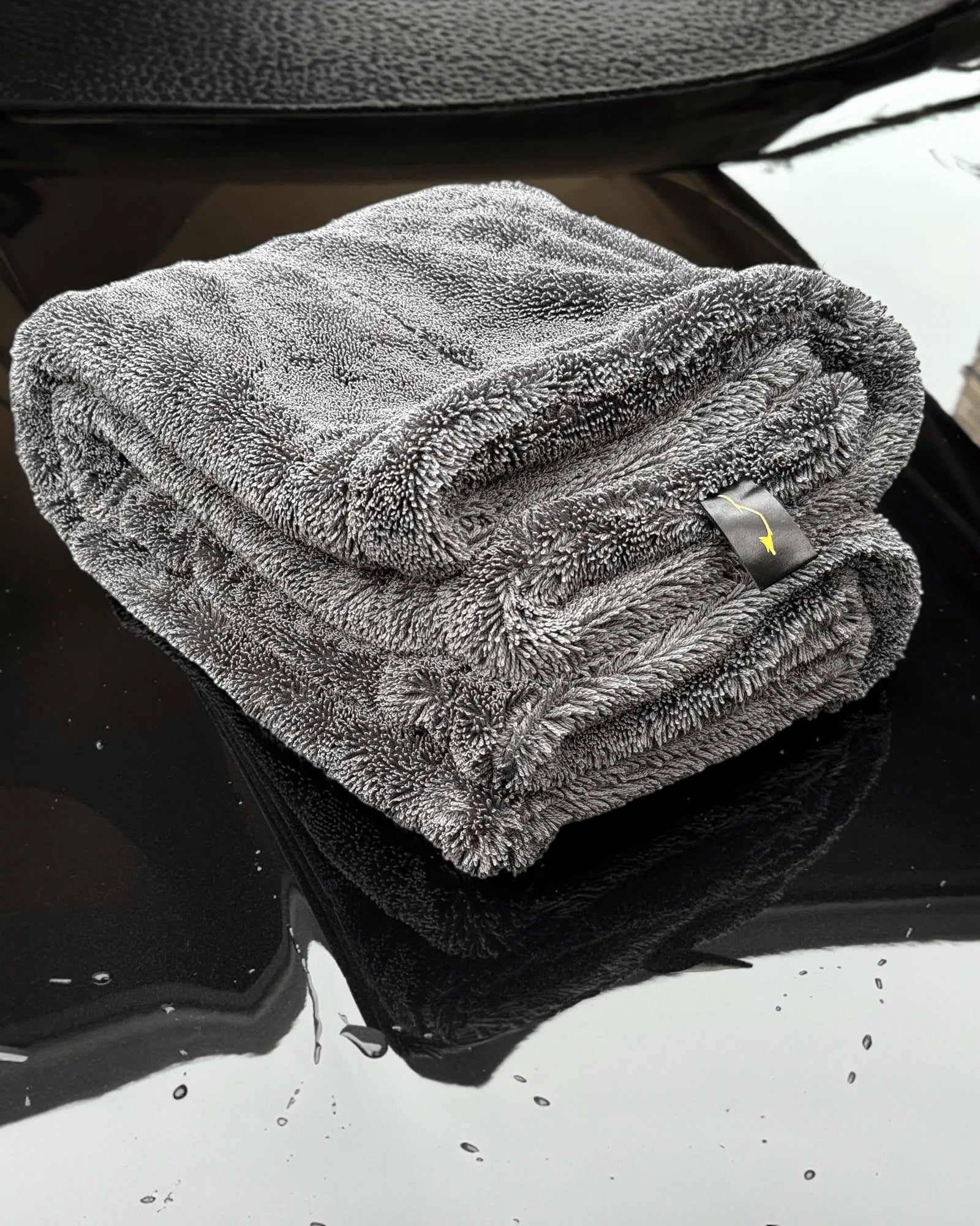 Sleek Max Dry 2K Car Drying Towel – 2000GSM Ultra Absorbent Microfiber for Cars, SUVs, and Trucks – Folded View on Black Hood